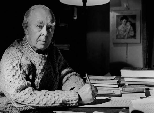 John Bowlby escreve à mesa